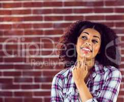 Attractive young woman smiling and daydreaming