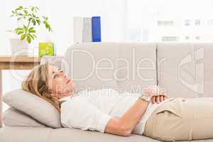 Unhappy female patient lying on therapists couch