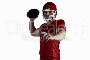 American football player throwing ball