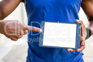 Athletic man using tablet computer