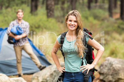 Portrait of a young pretty hiker with hands on hips