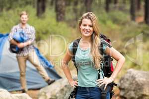 Portrait of a young pretty hiker with hands on hips