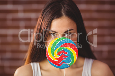 Pretty hipster with lollipop