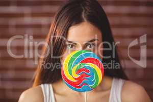 Pretty hipster with lollipop