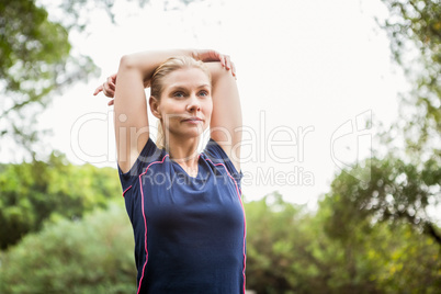 Athletic woman doing arms stretching