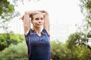 Athletic woman doing arms stretching