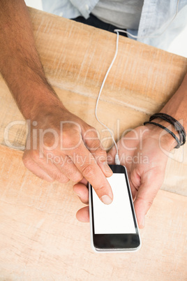 Hands touching smartphone