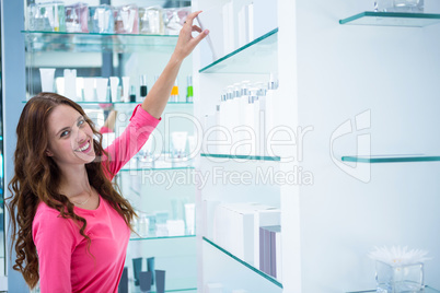 Pretty woman shopping for cosmetics