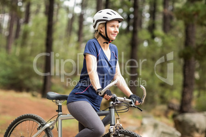 Pretty young biker looking away