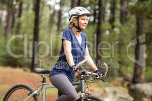 Pretty young biker looking away