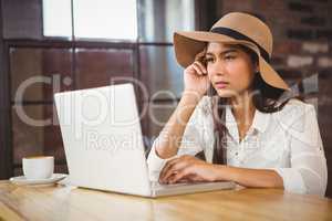 A businesswoman using her laptop