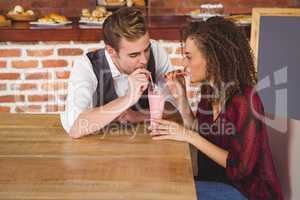 Cute couple sitting in cafe