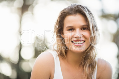 Pretty young jogger smiling at the camera