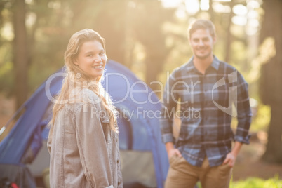 Happy young camper couple smiling