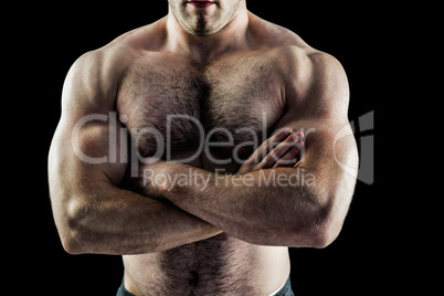 Handsome bodybuilder with arms crossed