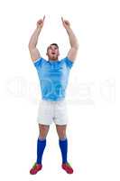 Rugby player cheering and pointing