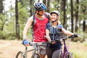 Happy young biker couple looking at each other