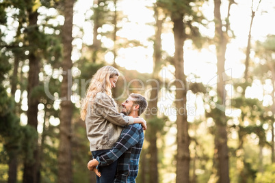 Smiling handsome man holding his girlfriend