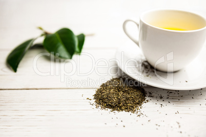 Cup of herbal tea on table