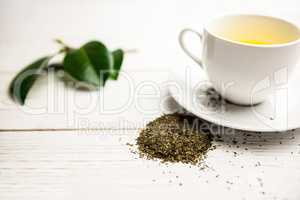 Cup of herbal tea on table