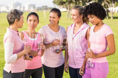 Women wearing pink for breast cancer and talking