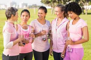 Women wearing pink for breast cancer and talking