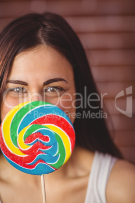 Pretty hipster with lollipop