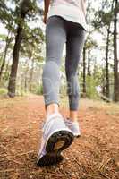 Young happy jogger walking