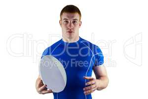 Rugby player holding rugby ball