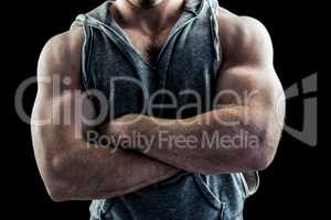 Handsome bodybuilder with arms crossed