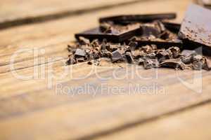 Pieces of chocolate on a wooden table