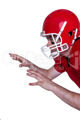 American football player about to catch a ball