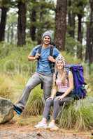 Portrait of a young smiling hiker couple