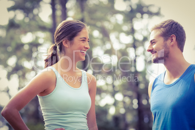 Happy joggers looking at each other