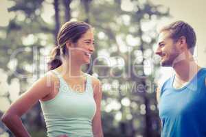 Happy joggers looking at each other