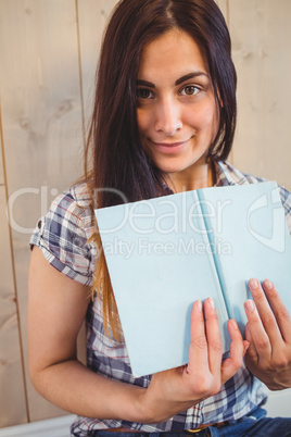 Pretty hipster reading blue book