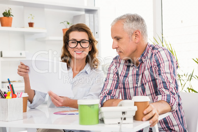 Casual designers brainstorming at working desk