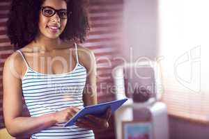 Happy beautiful hipster holding her tablet