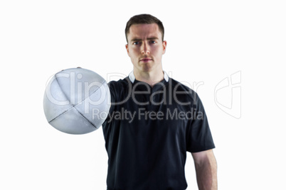Rugby player handing a rugby ball