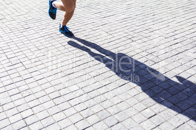 Close up view of athletes legs running