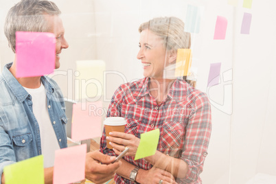 Casual business colleagues laughing at work