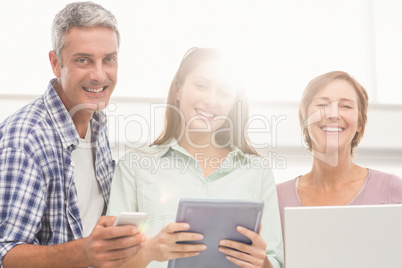 Casual business people with electronic devices