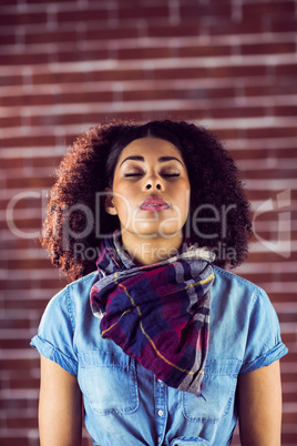 Attractive young woman with eyes closed