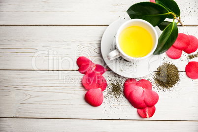 Cup of herbal tea on table