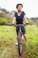 Athletic blonde sitting on mountain bike
