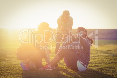 Sporty women doing sit ups during fitness class