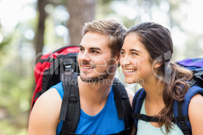 Young happy joggers looking at something in the distance