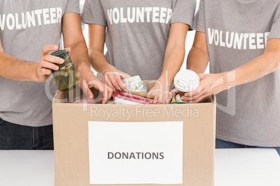 Volunteers sorting donations