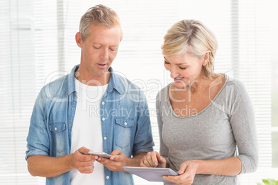 Business colleagues working on tablet and phone