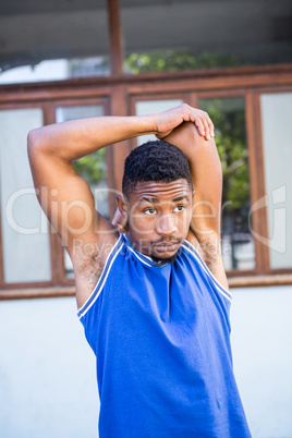 An handsome athlete stretching